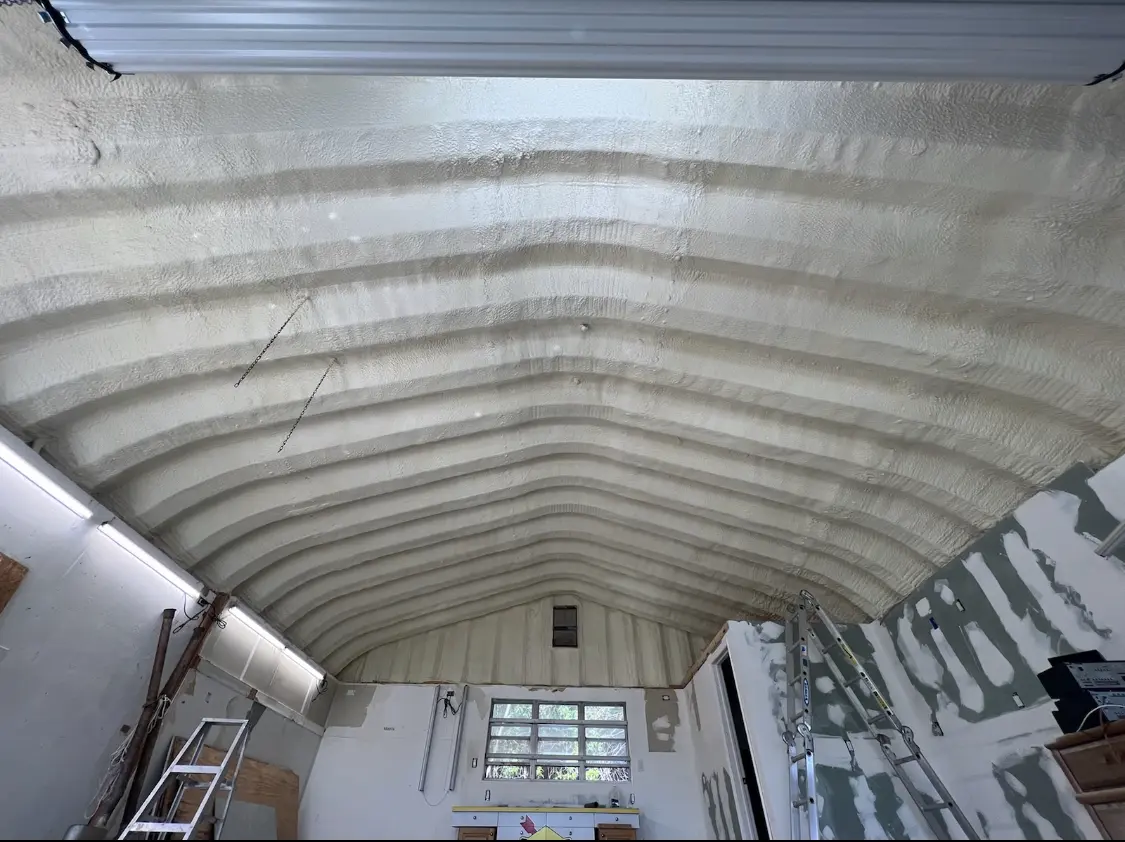 Spray polyurethane foam applied to the underside of a metal roof deck in Niagara